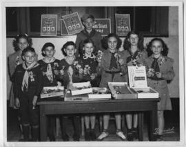 Boy Scouts and girl Scouts selling Christmas seals